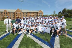 Brian Vail photo: The Mercyhurst University men’s lacrosse team with their ECAC Championship banner affter their win against Lake Erie College.